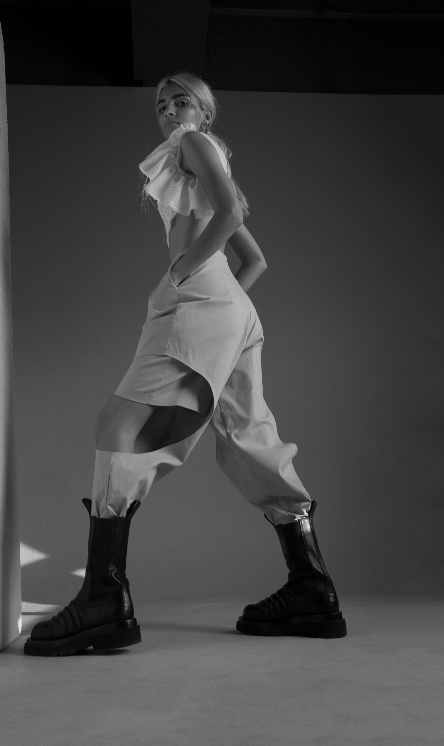 Nude gabardine two layered pant/shorts with side cut outs.