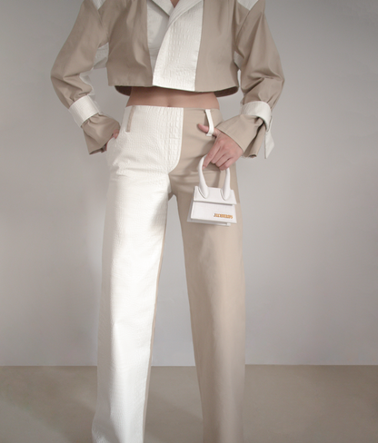Two tone flare pants made with faux croc leather and nude gabardine. It comes with pockets and a side zipper.