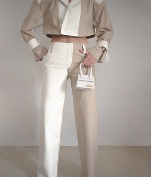 Cropped blazer made with pearl white faux crocodile leather and nude gabardine.