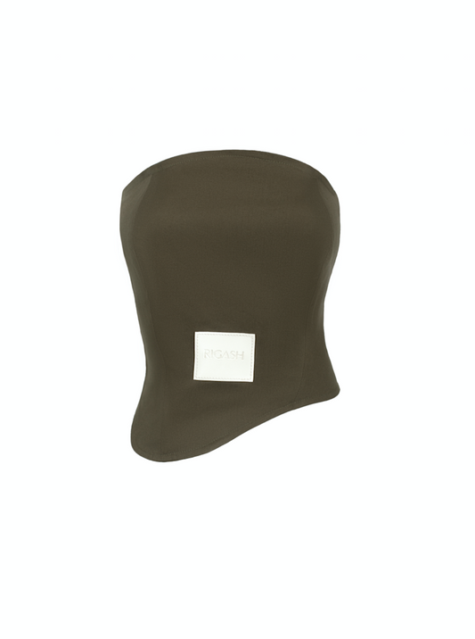 Asymmetrical corset top with a round strapless neckline. Back panels held together by brown leather belt. Visible front leather tag with embossed logo print. 